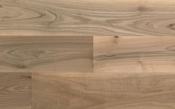 Engineered wood planks floor in European Walnut: brushed, stained, varnished.