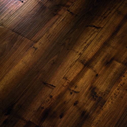 Engineered wood planks floor in European Walnut: hand planed, aged, stained, varnished.