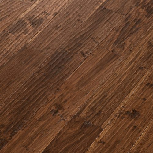 Engineered wood planks floor in American Walnut: hand planed, aged, stained, varnished.