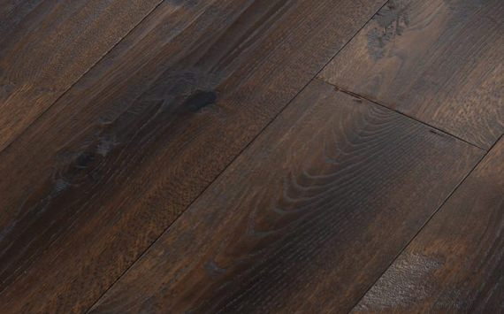 Engineered wood planks floor in Oak: hand planed, rounded, stained, varnished.