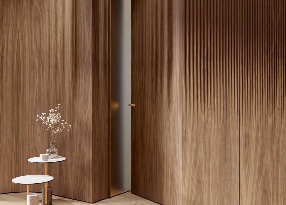 Detail of curved Code 3D wood panelling, featuring Shade 3D fluting that gradually becomes less pronounced from the top to the bottom, and an integrated door.